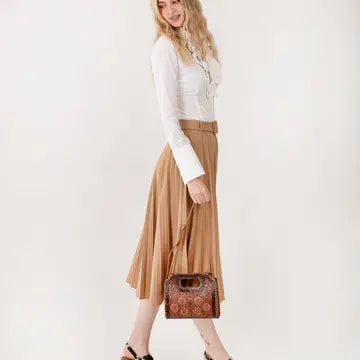 Stylish Frontier Fashion Bag paired with cowboy boots and denim jeans for a classic western cowgirl outfit.