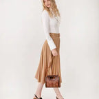 Stylish Frontier Fashion Bag paired with cowboy boots and denim jeans for a classic western cowgirl outfit.