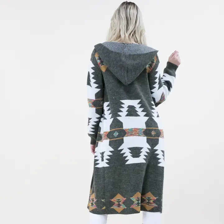 Fashionable Aztec print hoodie cardigan layered over a western outfit for everyday cowgirl style and comfort.