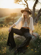 Stylish black velvet bell bottom pants paired with a modern cowgirl outfit for country fashion lovers.