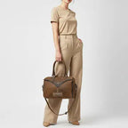 Brown Mesa Ridge western leather handbag featuring premium craftsmanship, decorative stitching, and spacious interior storage.