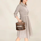 Stylish women's Dusty Trail leather purse featuring spacious compartments, antique metal details, and rustic western appeal.