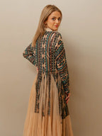 Stylish western kimono with Aztec patterns layered over a casual cowgirl outfit with boots and western accessories.