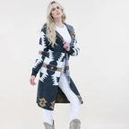 Stylish long western cardigan with Aztec patterns and hoodie design paired with cowgirl boots and casual outfit.