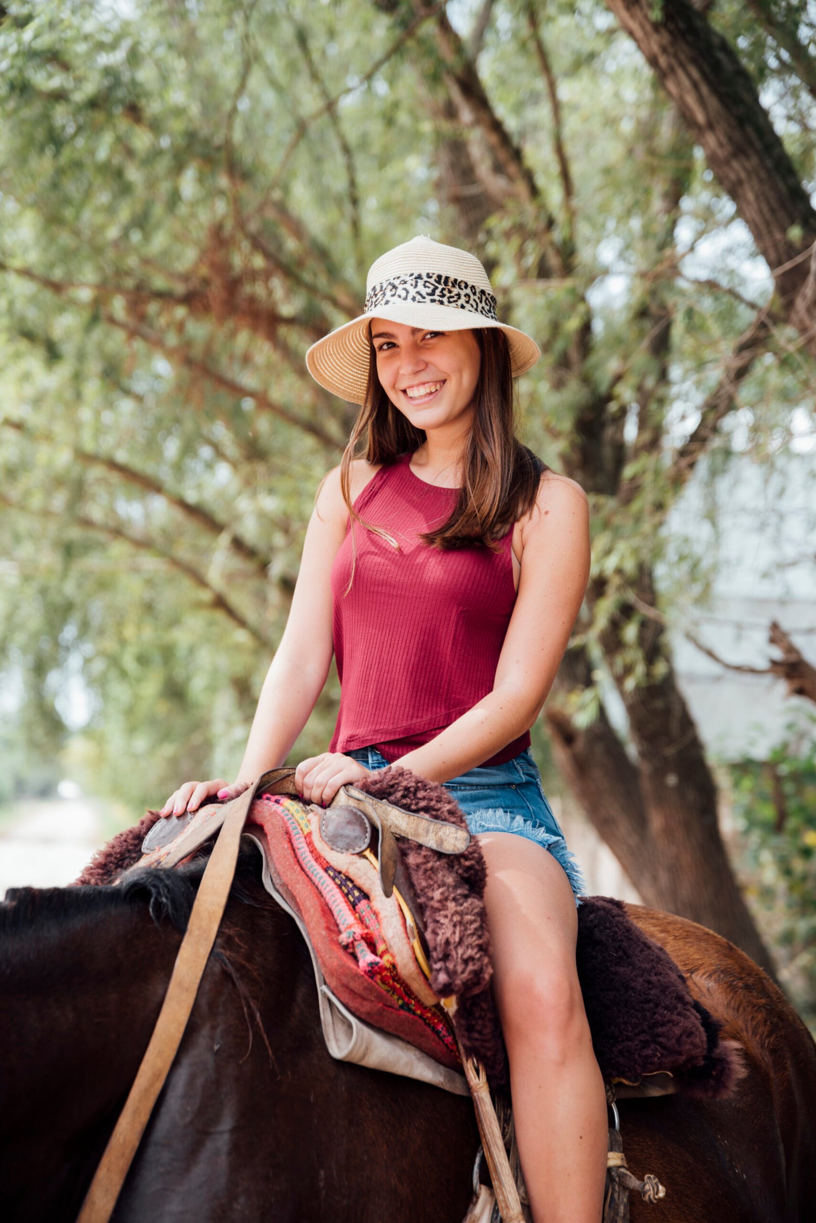 front view smiling woman riding horse