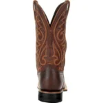 Brown women’s rodeo boots with floral embroidery, square toe design, and durable rubber outsole.
