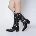 Brown leather star boots with white stitched star inlay and classic stacked Western heel.