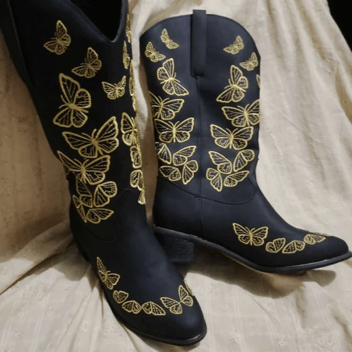 Black leather boots with butterflies embroidered along the shaft and classic Western heel.