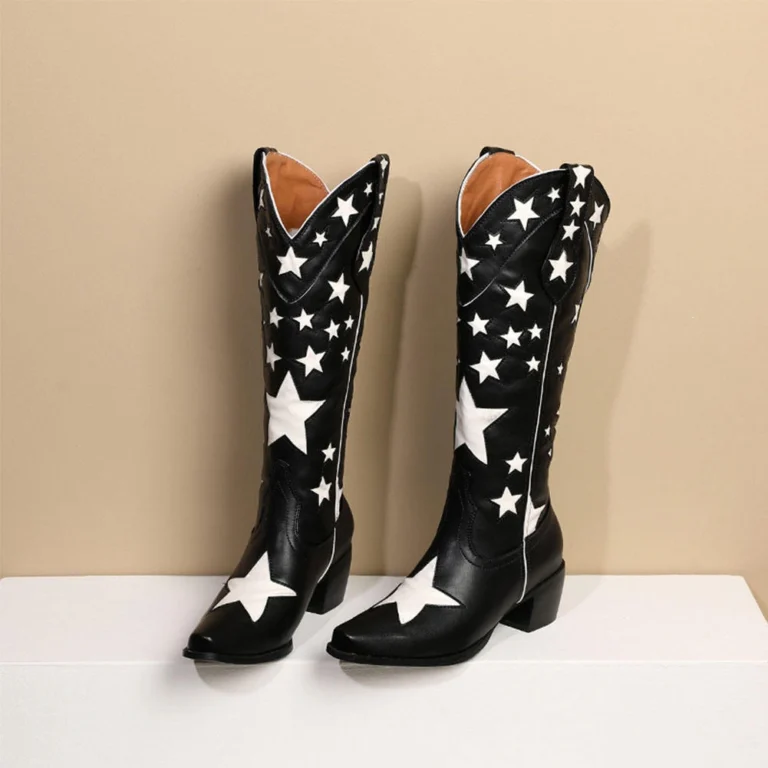 White star cowboy boots featuring contrast star embroidery and pointed toe design.