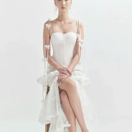 Elegant midi wedding guest dress in pastel pink with A-line silhouette and subtle lace details