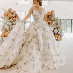 Blue camo wedding dress with flowing skirt and elegant bridal design