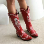 Black and red women's cowboy boots with decorative patterns