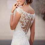 Romantic whimsical wedding dress with bell sleeves and boho lace design
