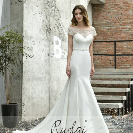 Elegant short sleeve wedding dress with lace bodice and flowing bridal skirt