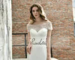 Classic bridal gown with short sleeves and elegant lace details