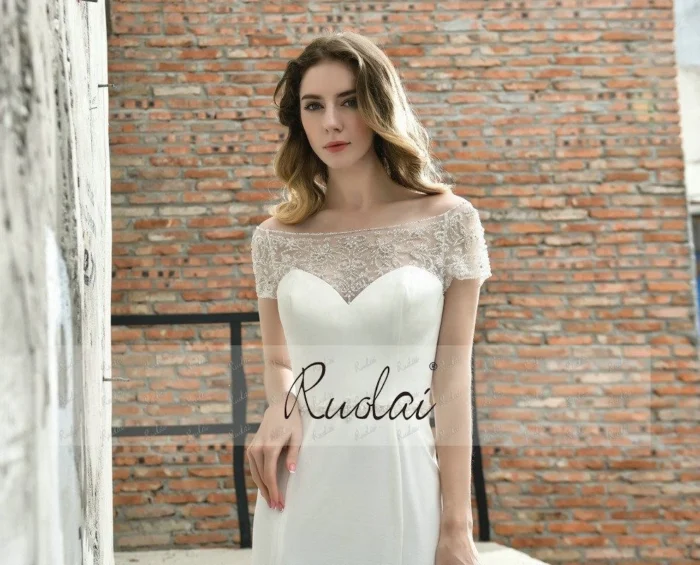 Classic bridal gown with short sleeves and elegant lace details
