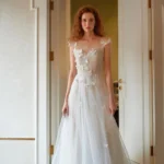Elegant simple wedding dress with clean silhouette and soft satin fabric for a modern bridal look