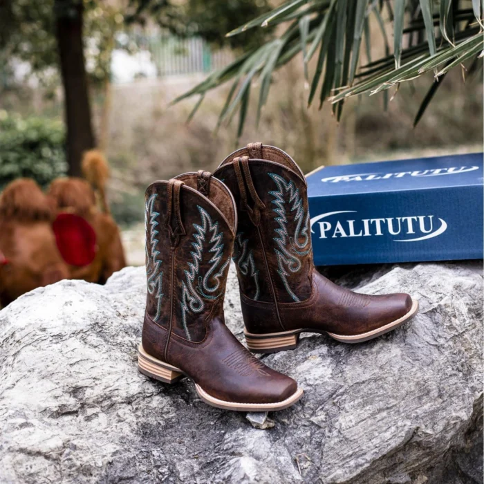 Black cowhide cowboy boots men style with square toe and reinforced stitching.