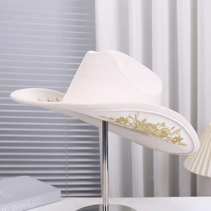 Western stagecoach cowgirl hat paired with denim outfit and boots