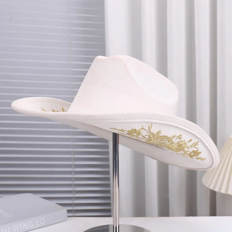 Western stagecoach cowgirl hat paired with denim outfit and boots