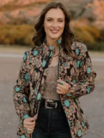 Woman wearing a tailored women’s western blazer styled with cowboy boots and denim jeans