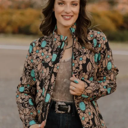 Woman wearing a tailored women’s western blazer styled with cowboy boots and denim jeans