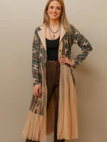 Woman wearing a flowing women’s western kimono styled with denim jeans and cowboy boots for a boho cowgirl fashion look.