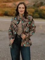 Chic women’s western blazer paired with boots and accessories for a country concert and western outfit style.