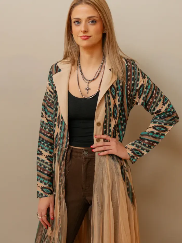 Fashionable ladies western kimono worn with denim and layered accessories for a modern western streetwear outfit.