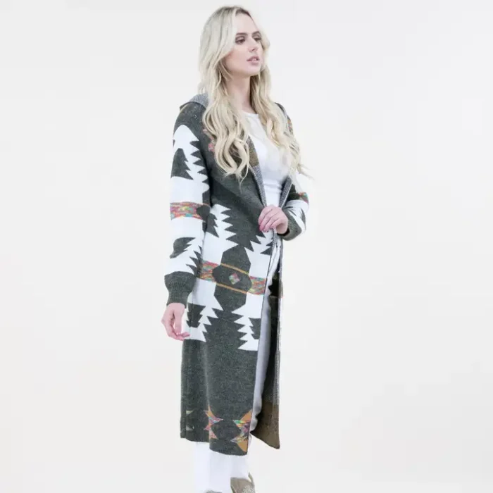 Curvy woman wearing a long Aztec print hoodie cardigan styled for plus size western wear fashion with boots and jeans.