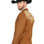 Confident man in a western blazer outfit combining denim, boots, and cowboy-inspired styling for a classic western appearance.