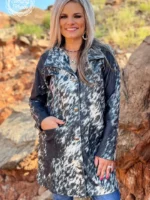 Stylish women’s western cardigan with fringe detailing paired with a boho cowgirl outfit and western accessories.