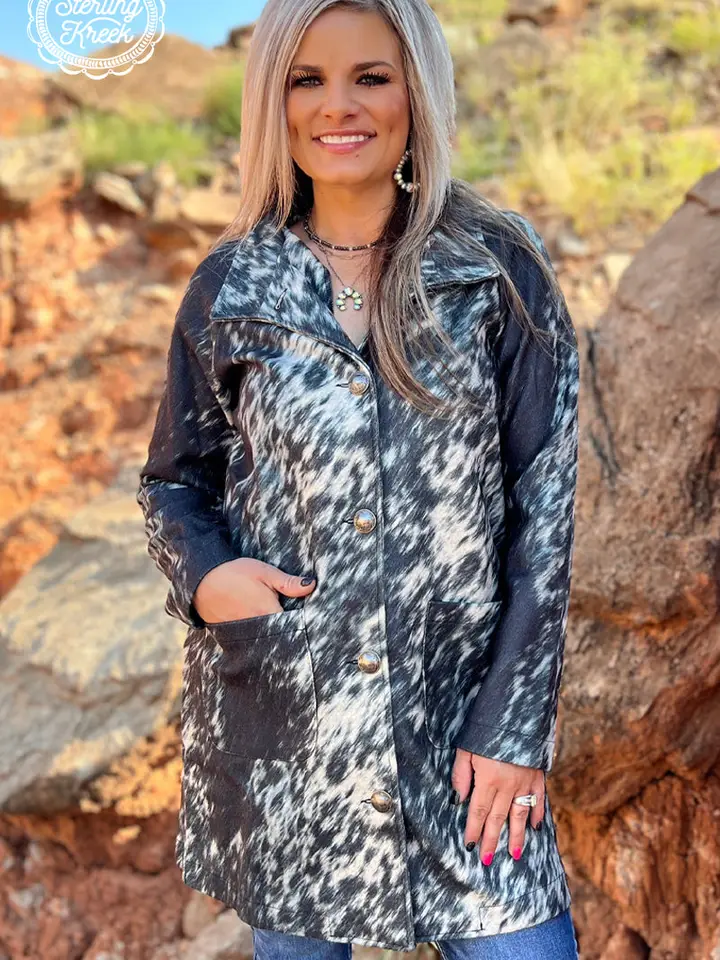 Stylish women’s western cardigan with fringe detailing paired with a boho cowgirl outfit and western accessories.