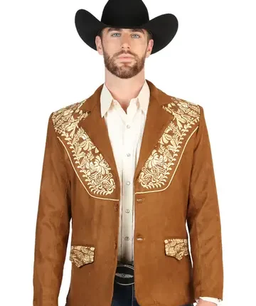 Man wearing a structured men’s western blazer styled with cowboy boots and denim for a rodeo-inspired fashion look.