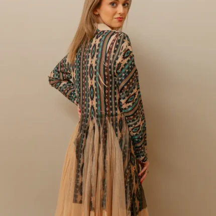 Stylish western kimono with Aztec patterns layered over a casual cowgirl outfit with boots and western accessories.