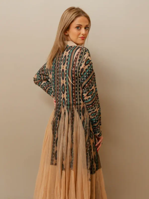 Stylish western kimono with Aztec patterns layered over a casual cowgirl outfit with boots and western accessories.