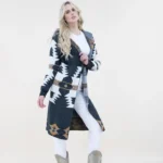 Stylish long western cardigan with Aztec patterns and hoodie design paired with cowgirl boots and casual outfit.