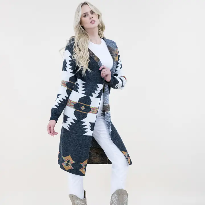 Stylish long western cardigan with Aztec patterns and hoodie design paired with cowgirl boots and casual outfit.