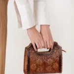 Elegant Frontier Fashion Bag featuring rustic leather texture and western-inspired design for everyday use.