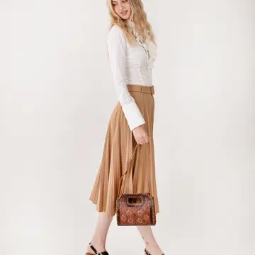Stylish Frontier Fashion Bag paired with cowboy boots and denim jeans for a classic western cowgirl outfit.