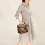 Stylish women's Dusty Trail leather purse featuring spacious compartments, antique metal details, and rustic western appeal.